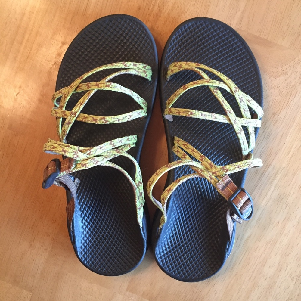 Brown and Yellow patterned, slip on Chaco sandals.